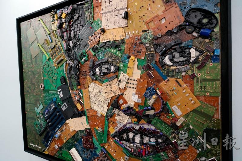 各种电子垃圾经过马来西亚艺术家诺迪占费斯的巧手，变成一幅人脸图。