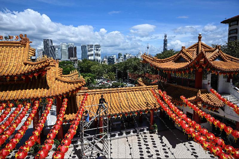 Workers install traditional Chinese lantern decorations at Thean Hou Temple in Kuala Lumpur ahead of the Lunar New Year. Photo courtesy: AFP