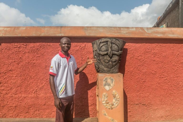 Voodoo's comeback has lured tourists to Porto-Novo, providing work for tourist guide Messie Boko. Photo courtesy: AFP