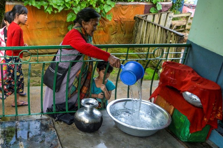 Every drop of rain water trickling down Tyllod Khongwir's rusty tin roof and into her house is collected -- even though she lives in one of the wettest places on earth. Photo courtesy: AFP