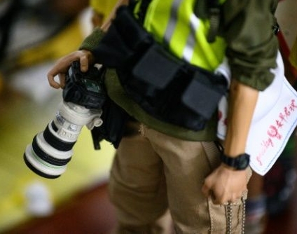 Among the 1:6 scale figures are journalists and white-collar workers. AFP