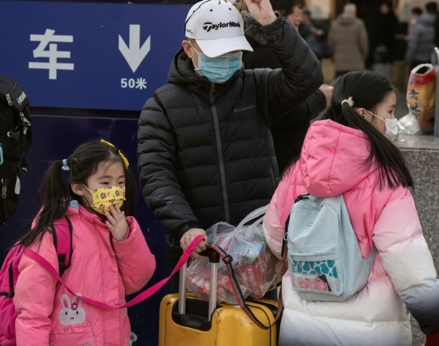 The discovery of human-to-human transmission comes as hundreds of millions of people are criss-crossing China in packed trains, buses and planes this week to celebrate the Lunar New Year. AFP