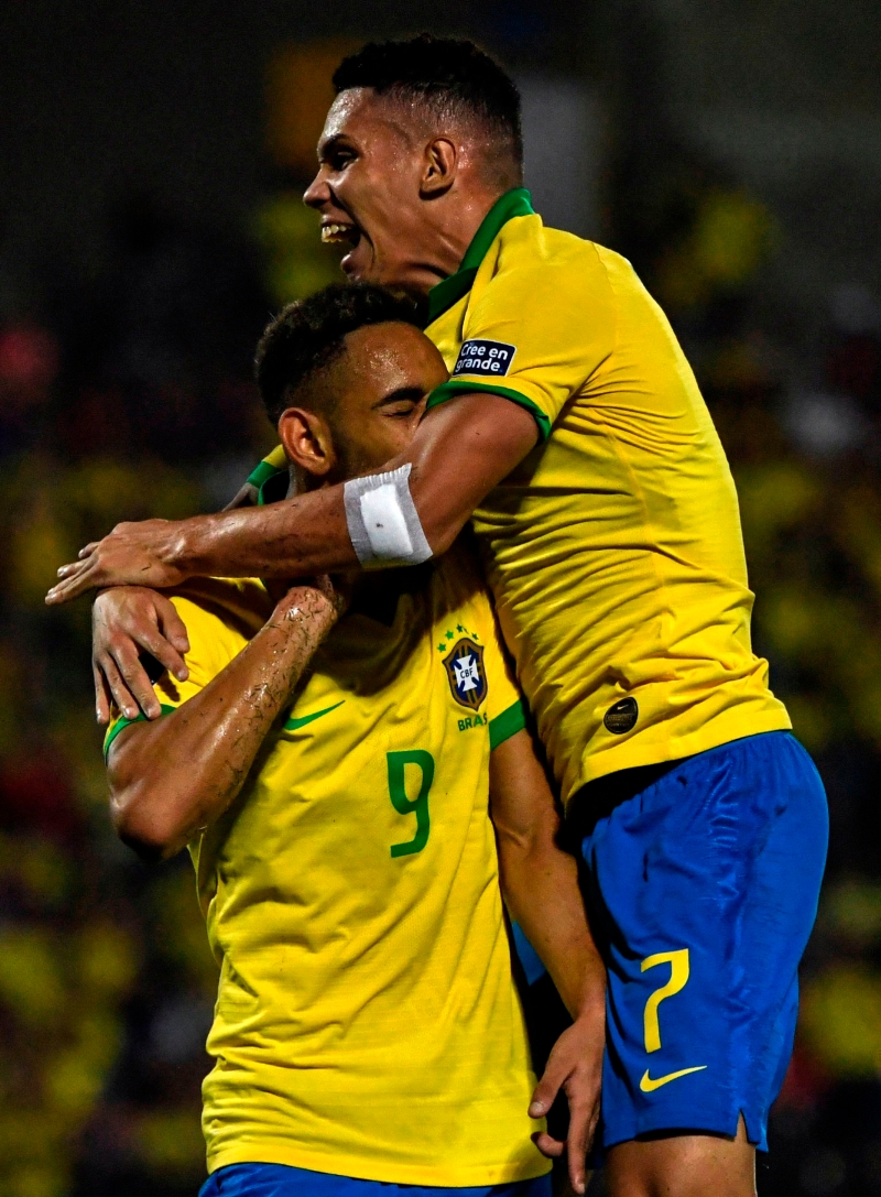 库尼亚（左）和保利尼奥的进球帮助巴西战胜阿根廷，获得今夏东京奥运会参赛权，届时要力争卫冕。（图：法新社）