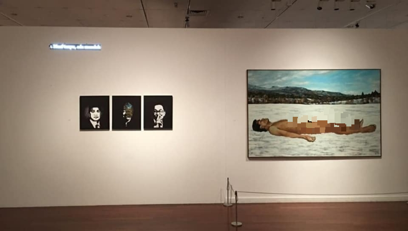 阿末弗亚2幅具争议性的画作，原本并列在国家艺术中心展示，左边是经过特殊处理的安华、马哈迪与阿兹敏肖像；右边是一幅仰卧的裸男图。