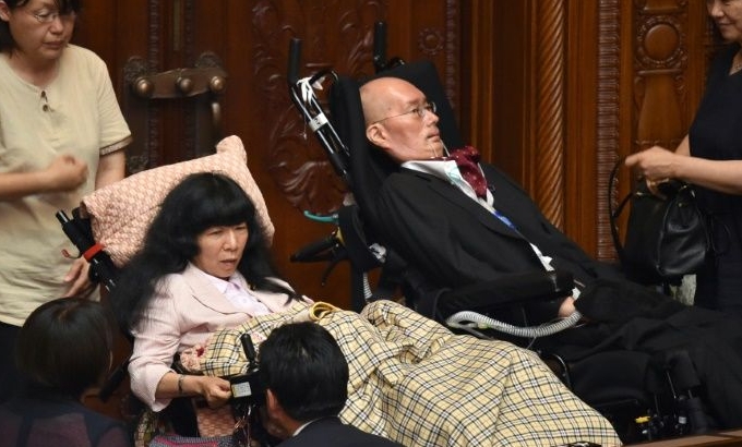 Wheelchair-bound lawmakers Eiko Kimura and Yasuhiko Funago are seeking to improve the lives of people with disabilities in Japan. AFP Wheelchair-bound lawmakers Eiko Kimura and Yasuhiko Funago are seeking to improve the lives of people with disabilities in Japan. AFP
