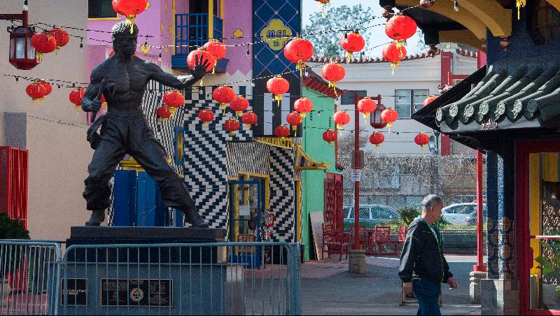 A man walks in the deserted Los Angeles Chinatown as people stay away due to fear of the COVID-19 epidemic. AFP