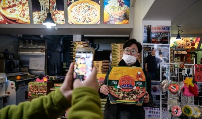 Sales have doubled at Sky Pizza in southern Seoul, a nondescript 10-seat restaurant and takeaway where a scene from 'Parasite' was filmed. AFP