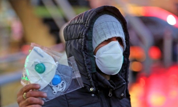 A street vendor sells protective masks in Tehran. AFP A street vendor sells protective masks in Tehran. AFP