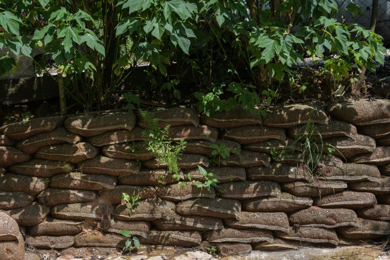 A rainwater containment wall made of potato bags filled with soil are seen at the Vila Nova Esperanca. AFP