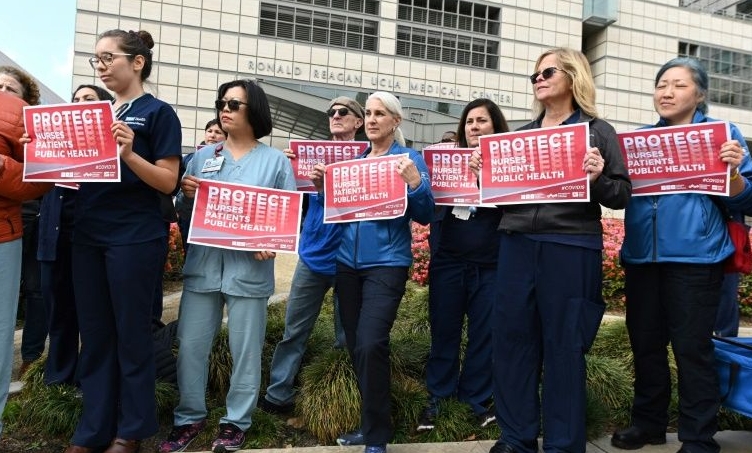 Nurses protest what they call the weak US response to the coronavirus outside UCLA Medical Center in Los Angeles. AFP Nurses protest what they call the weak US response to the coronavirus outside UCLA Medical Center in Los Angeles. AFP