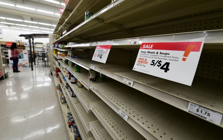 Panic-buying as people stock up on essentials fearing a lengthy period of enforced quarantine. AFP