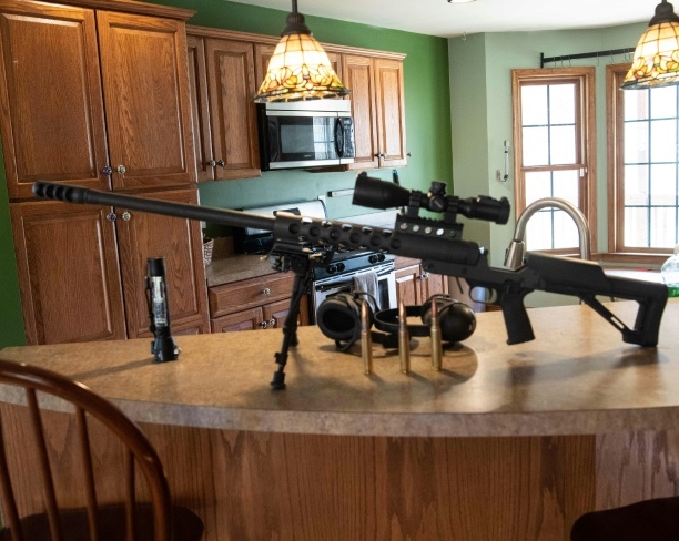 A 50-caliber gun on a counter top inside Fortitude Ranch to show would-be new recruits how seriously the members take this enterprise. AFP
