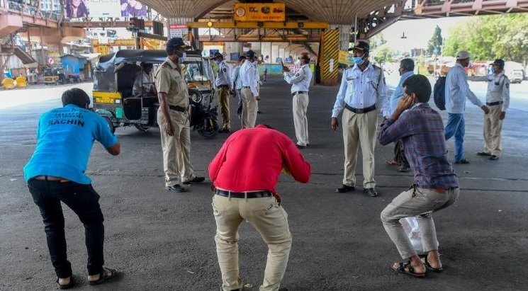 Mumbai police order people to do sit-ups as punishment for going out without a valid reason during a government-imposed nationwide lockdown in India. AFP