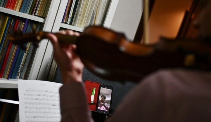 Second violinist Sohei Birmann said the initial stab at remote playing was 'totally out of rhythm'. AFP