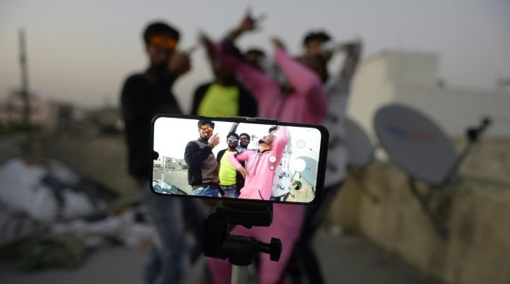 Indians make a TikTok video on the terrace of their house. AFP Indians make a TikTok video on the terrace of their house. AFP