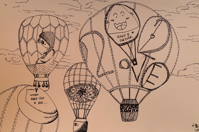 小宝画的圆形变成了大小不一的热气球，上面许下“希望人们可以开心平安的度过2020年”的愿望。（图：星洲日报）