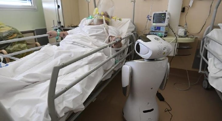 One of the six robots of Circolo di Varese Hospital stands near a patient. AFP One of the six robots of Circolo di Varese Hospital stands near a patient. AFP
