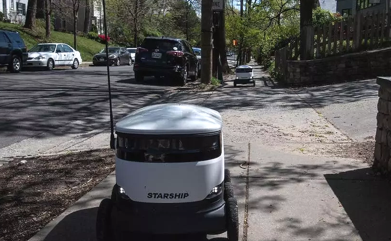 A Starship delivery robot leaves the Broad Branch Market grocery store in Washington, DC, on its way to a customer's house. AFP A Starship delivery robot leaves the Broad Branch Market grocery store in Washington, DC, on its way to a customer's house. AFP