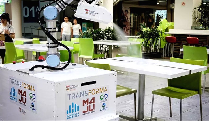 The robot can be controlled remotely with a laptop or tablet, reducing the risk to cleaners of becoming infected with the virus. AFP