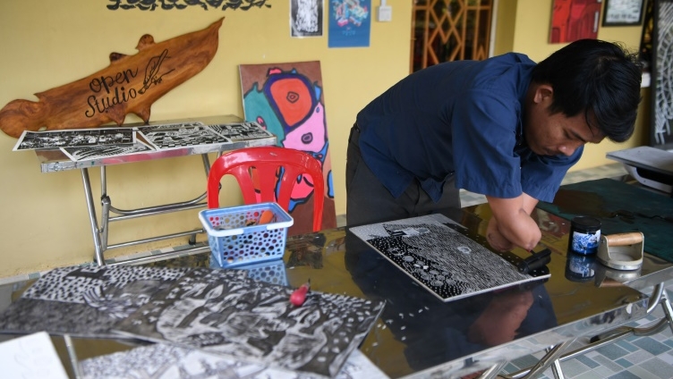 Morn Chear works with an arts collective based in Siem Reap, where he specializes in Linocut block printing -- a technique rarely used in Cambodia. AFP Morn Chear works with an arts collective based in Siem Reap, where he specializes in Linocut block printing -- a technique rarely used in Cambodia. AFP