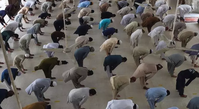 Worshippers maintain social distancing at a mosque in Karachi. AFP Worshippers maintain social distancing at a mosque in Karachi. AFP