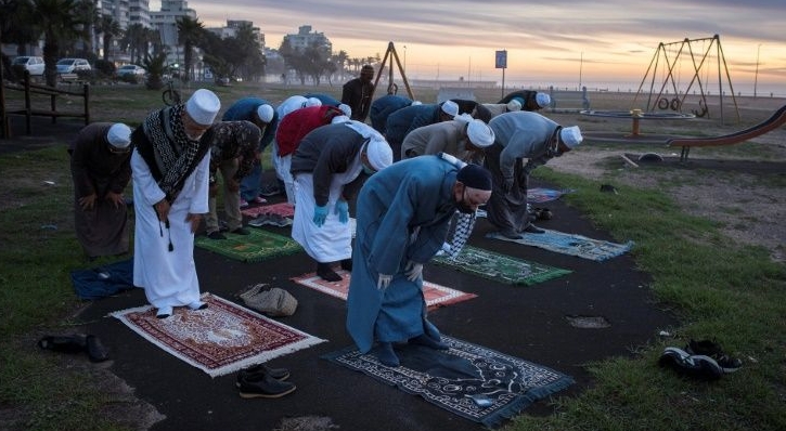 Muslims pray in Cape Town before looking for the crescent moon that signals the start of Ramadan. AFP Muslims pray in Cape Town before looking for the crescent moon that signals the start of Ramadan. AFP