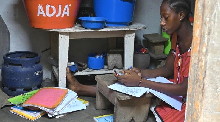 This schoolgirl in Ivory Coast is receiving lessons via WhatsApp. AFP This schoolgirl in Ivory Coast is receiving lessons via WhatsApp. AFP