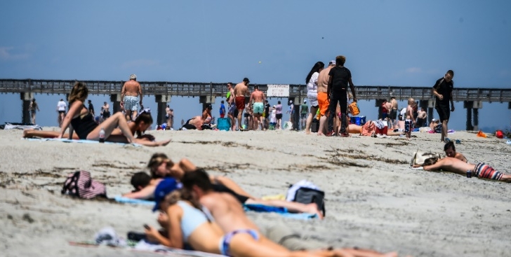 Beachgoers in the US state of Georgia flock to the shore after the government lifts lockdown orders. AFP Beachgoers in the US state of Georgia flock to the shore after the government lifts lockdown orders. AFP