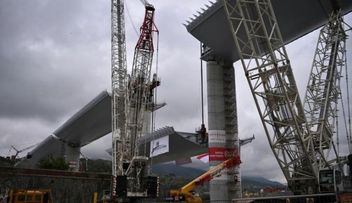 Construction of the gleaming structure in Italy's Liguria region has continued night and day throughout a national lockdown. AFP