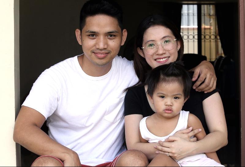 Tai posing with her husband Gene and son Carson. SIN CHEW DAILY