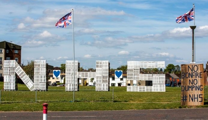 Wooden Pallets spelling out NHS to show support and thanks for the National Health Service, in the Loyalist area of Portadown, east Belfast. AFP
