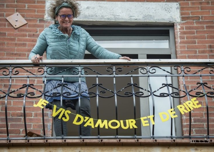 Montreal resident Valerie Menguy shows off her banner reading 