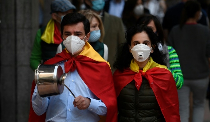 People protest in Madrid against government measures during the national lockdown. AFP People protest in Madrid against government measures during the national lockdown. AFP