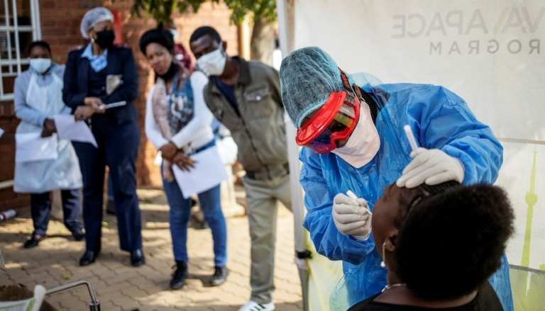 A Doctors Without Borders nurse performs a swab test for COVID-19 in Lenasia, Johannesburg. AFP A Doctors Without Borders nurse performs a swab test for COVID-19 in Lenasia, Johannesburg. AFP