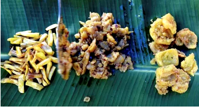 A worker at Varghese Tharakkan's Ayur jackfruit farm displaying jackfruit dishes. AFP A worker at Varghese Tharakkan's Ayur jackfruit farm displaying jackfruit dishes. AFP