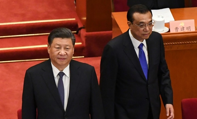 President Xi Jinping (L) and Premier Li Keqiang arrive for the opening  of the Chinese People's Political Consultative Conference. AFP