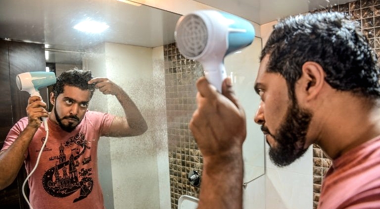 Mumbai-based communications executive Suraj Balakrishnan's regimen includes oils for his beard, body and hair. AFP