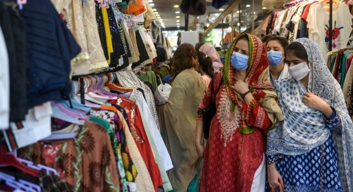 Women shop for clothes ahead of the Eid al-Fitr holiday in the Pakistani city of Karachi. AFP