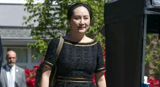 Meng Wanzhou walks down her driveway to her car as she departs her home for court. AFP