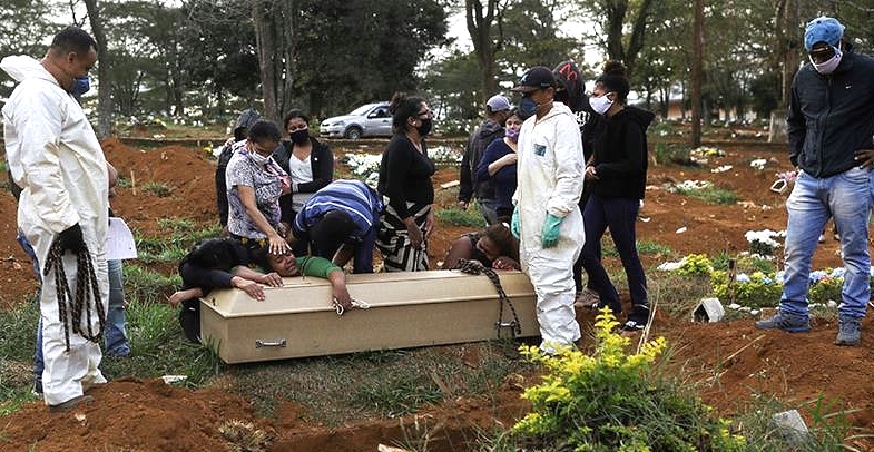 Relatives attend the burial of a coronavirus victim in Sao Paulo.