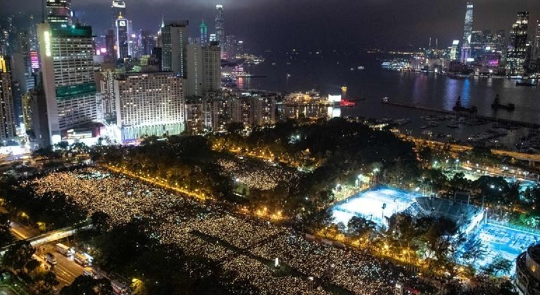 June 4, 2019 file photo shows people attending a candlelight vigil at Victoria Park in Hong Kong to mark the 30th anniversary of the Tiananmen crackdown in Beijing. AFP