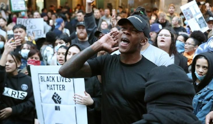 UFC figther Israel Adesanya was among thousands who took to the streets. AFP