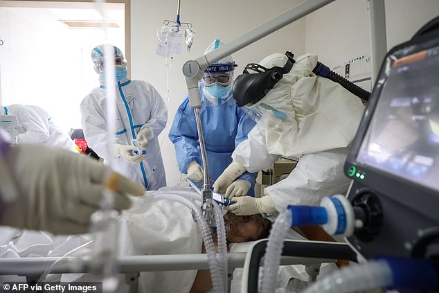Dr Yi and Dr Hu were saved by a life-support machine called ECMO. The picture shows medical staff treating a critical patient with an ECMO at the Red Cross hospital in Wuhan. AFP