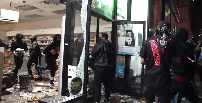 Looters hit stores in New York where the mayor has imposed an overnight curfew. AFP