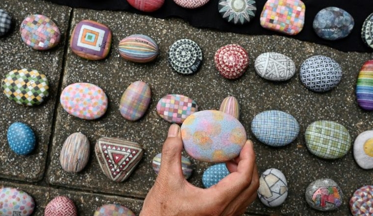 Wu has been selling intricately painted pebbles on Taiwan's streets for the last 40 years. AFP