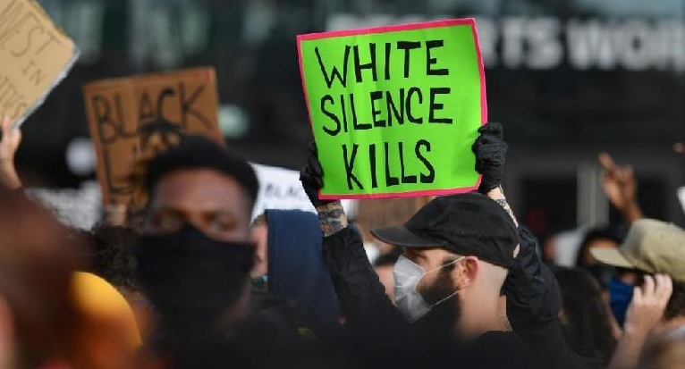 Protestors hold up placards during a Black Lives Matter demonstration in New York. AFP