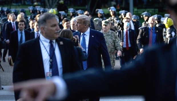 Trump walks walks across Lafayette Square in a stage-managed show of force. AFP