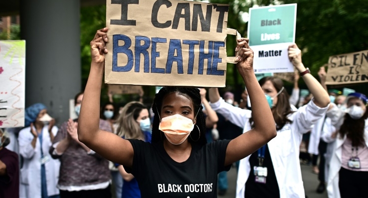 Nurses and healthcare workers attend a 'Black Lives Matter' rally in front of Bellevue Hospital in New York City. AFP