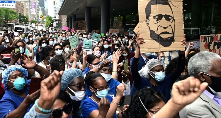 Nurses and healthcare workers attend a 'Black Lives Matter' rally in front of Bellevue Hospital in New York City. AFP