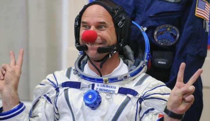 Canadian space tourist and Cirque du Soleil founder Guy Laliberte jokes during space suit testing prior to his blast off in 2009. AFP